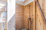Rinse off after a day at the beach in the fully enclosed outdoor shower